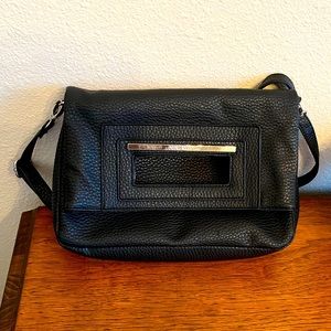 Nine West black handbag shoulder bag with adjustable strap and silver accents.